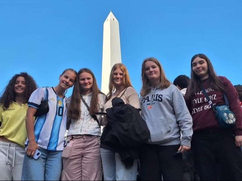 Teens on program posing in front of landmark in Buenos Aires