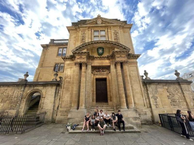 The Teen Travel group exploring oxford in front of one of the University Buildings.