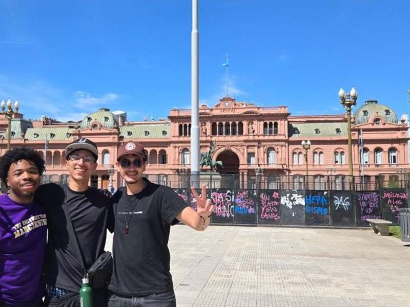Three students in front of Casa Rosada in Buenos Aires, Argentina.