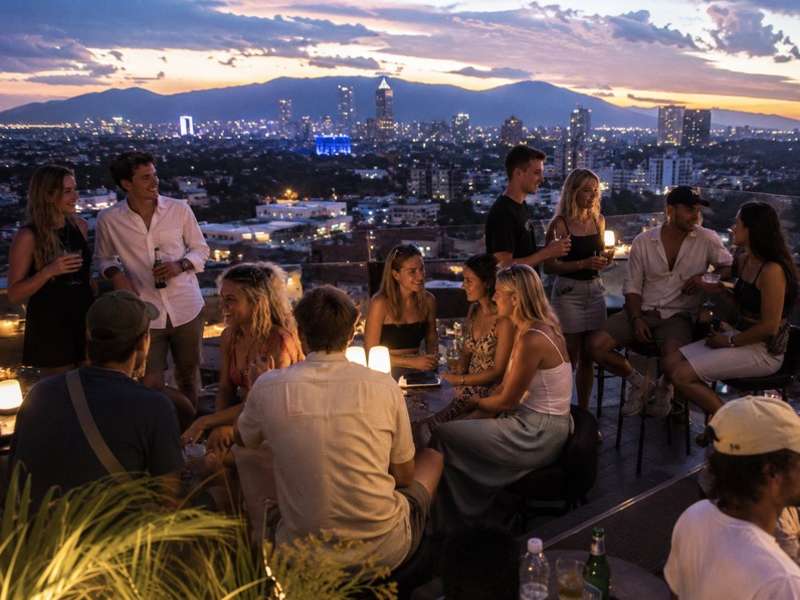 Travellers socialising at a rooftop bar in Chiang Mai