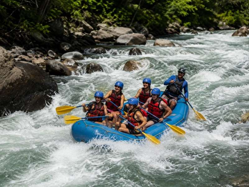 Travellers white water rafting through Costa Rica