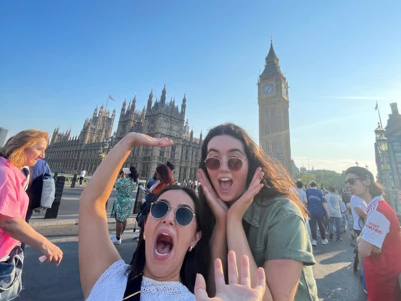 Two girls posing in front of Big Ben in London