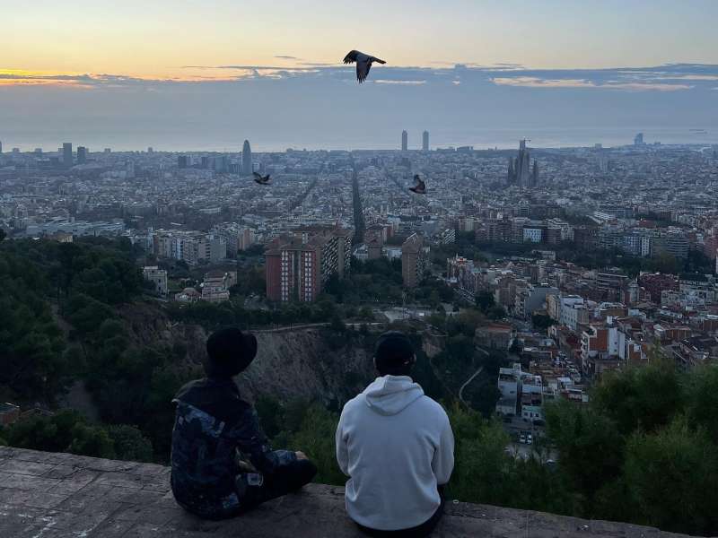 Two interns sitting on top of a roof in Barcelona, Spain!