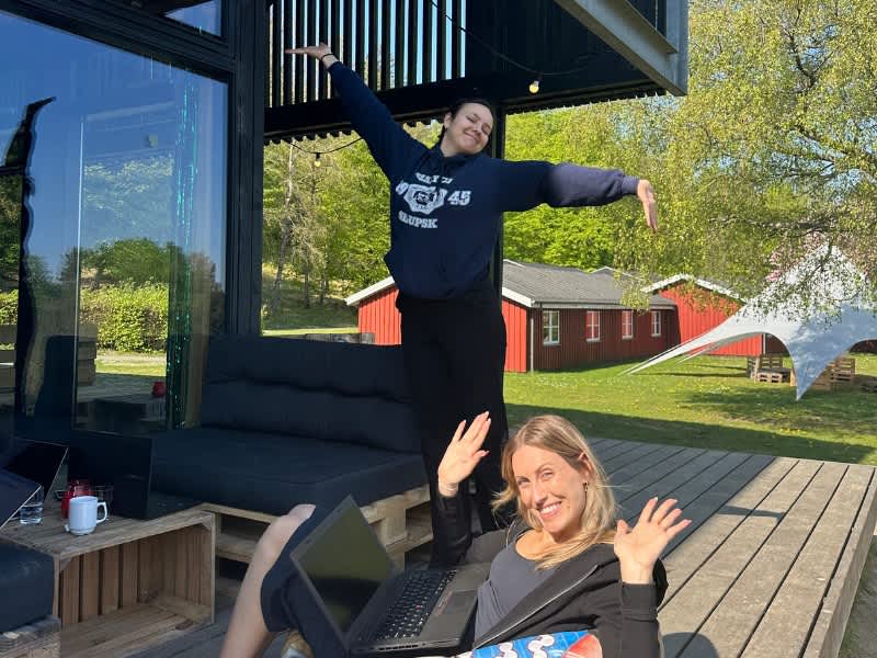 Two interns sitting outside working