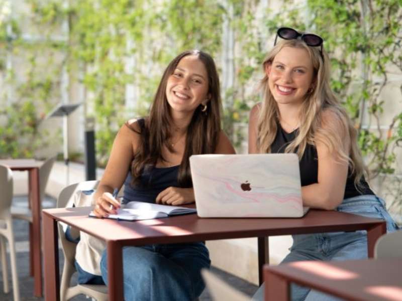Two study abroad students smiling