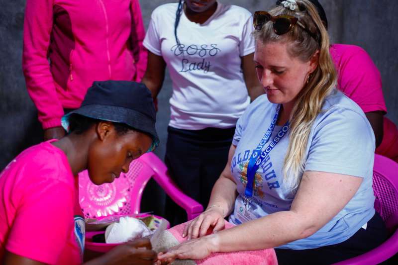 UCESCO volunteer with local women