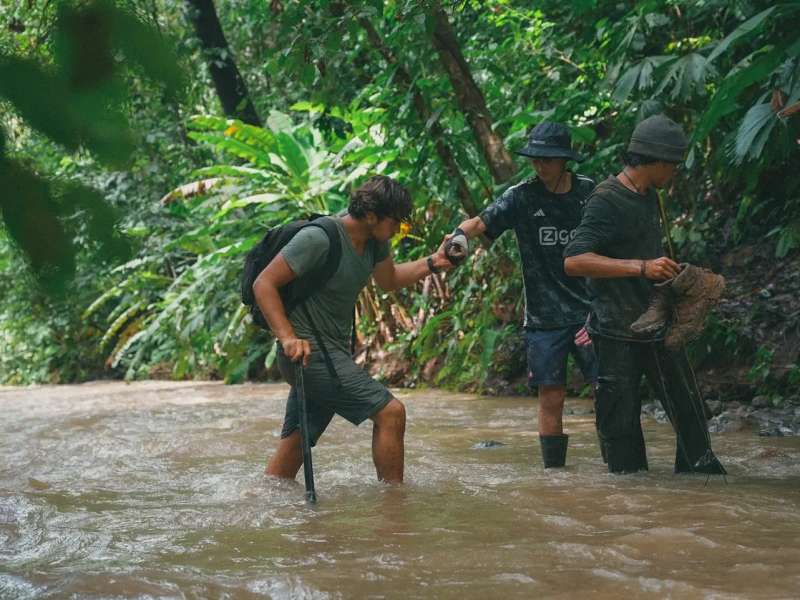 Venturers crossing river