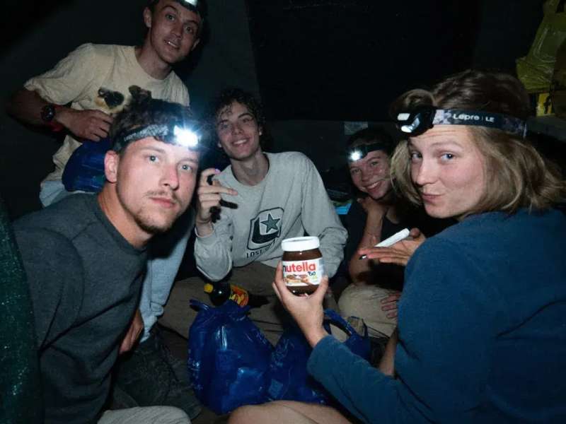 Venturers enjoy a snack at night