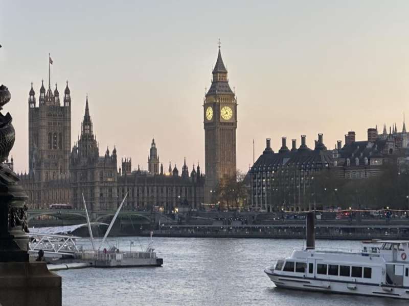 View of Big Ben and the Houses of Parliament along the River Thames in London.