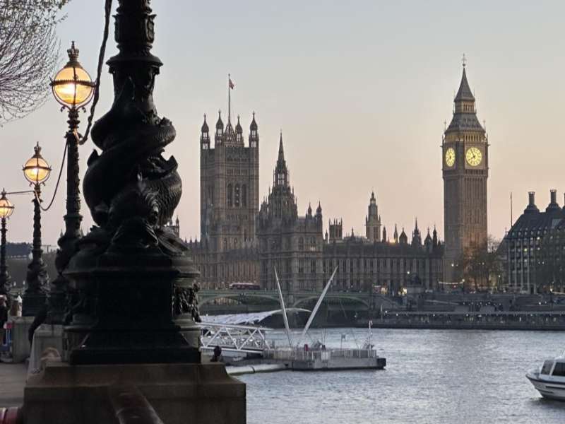 View of Big Ben and the Houses of Parliament along the River Thames in London.