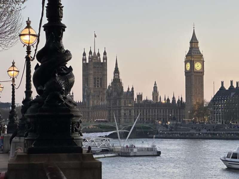 View of Big Ben and the Houses of Parliament along the River Thames in London.