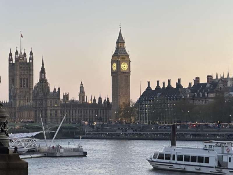 View of Big Ben and the Houses of Parliament along the River Thames in London.