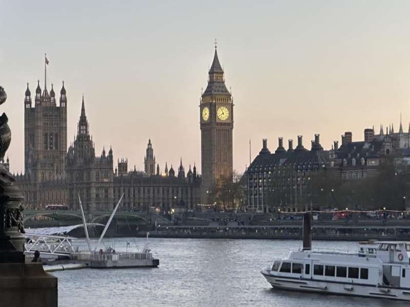 View of Big Ben and the Houses of Parliament along the River Thames in London.