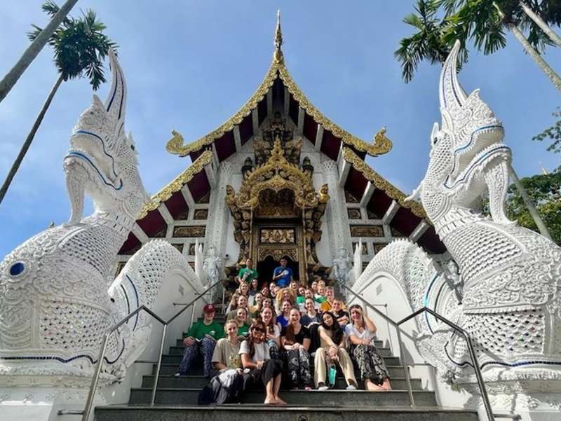 Volunteer group in front of temple in Thailand