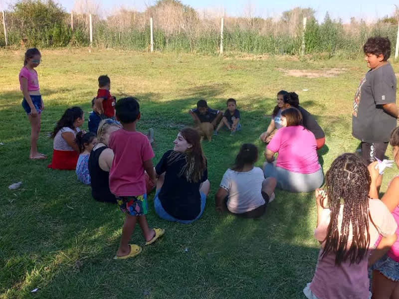 Volunteer playing with children