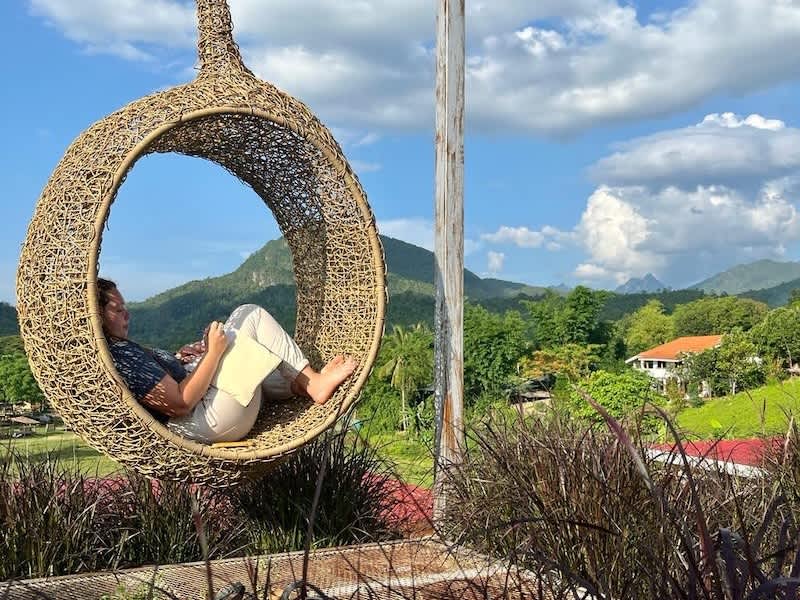 Volunteer resting in local Thai village in the middle of the jungle