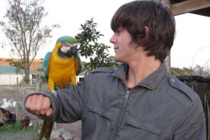parrot on volunteer's shoulder