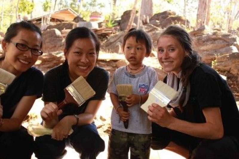 Volunteers and a kid