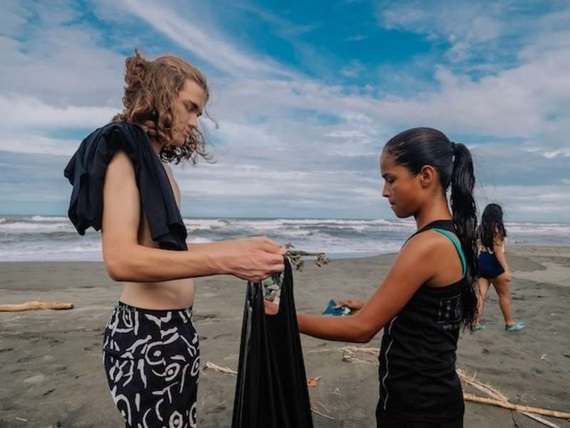 Volunteers doing a beach cleanup on a local beach in Costa Rica