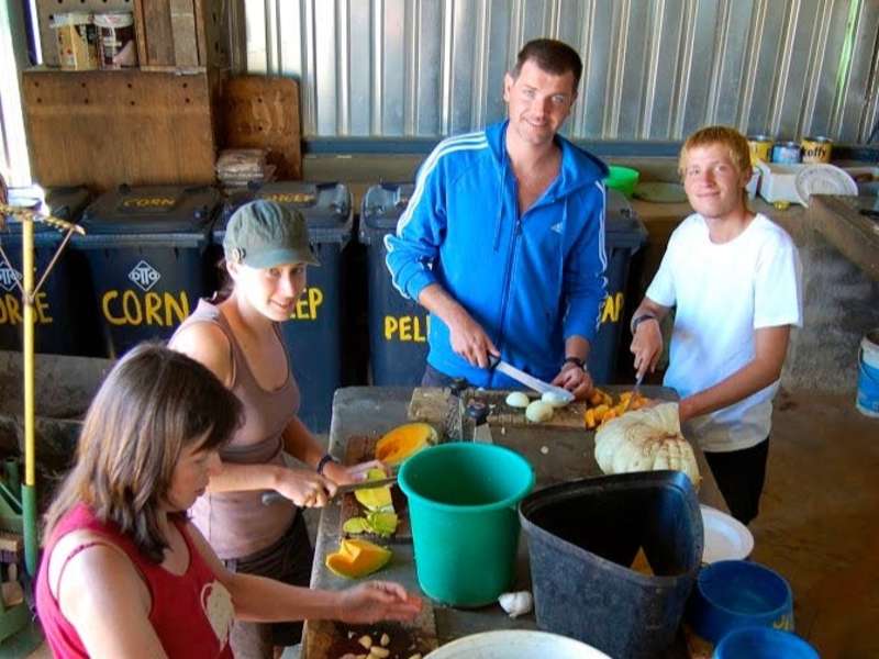 Volunteers preparing food for the animals