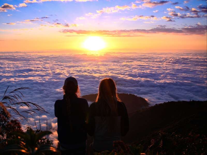 volunteers-watching-sunset-sea-of-clouds-guaranda
