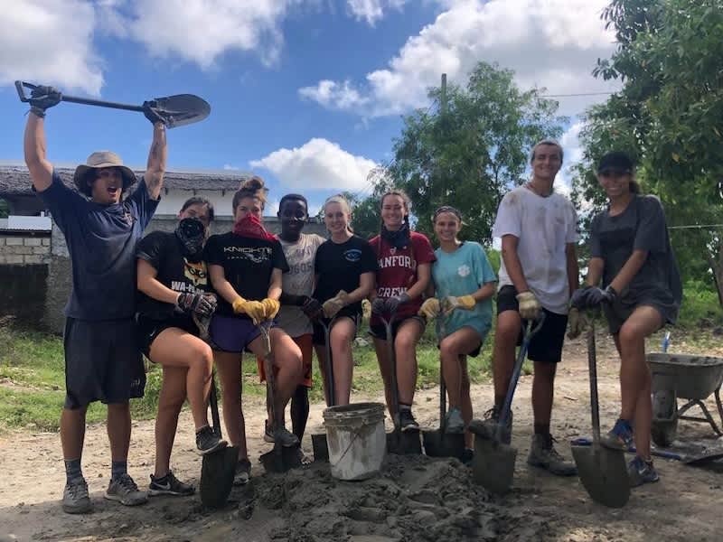 Volunteers working on construction project in local Tanzanian village