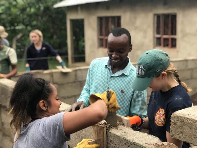 Volunteers working on Tanzania school construction projects with local
