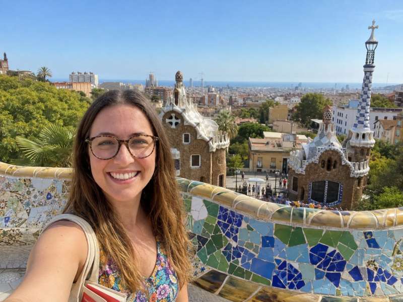 Young woman taking a selfie at Park Güell in Barcelona
